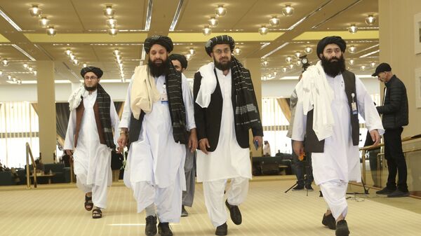 Afghanistan's Taliban delegation arrive for the agreement signing between Taliban and U.S. officials in Doha, Qatar, Saturday, Feb. 29, 2020. - اسپوتنیک افغانستان  