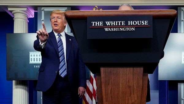 U.S. President Donald Trump stops a reporter from asking Dr. Anthony Fauci a question about use of the drug hydroxychloroquine to treat the disease caused by the new coronavirus near the end of the daily coronavirus task force briefing at the White House in Washington, U.S., April 5, 2020 - اسپوتنیک افغانستان  