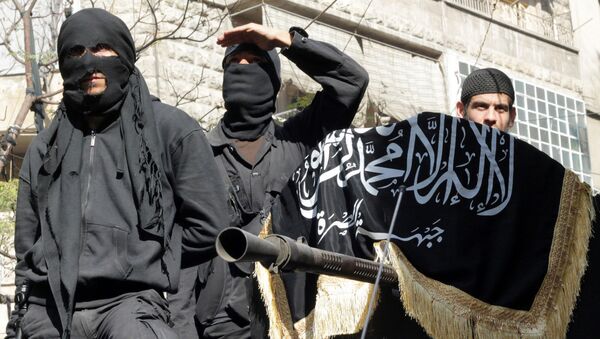 Members of jihadist group Al-Nusra Front take part in a parade calling for the establishment of an Islamic state in Syria, at the Bustan al-Qasr neighbourhood of Aleppo, on October 25, 2013 - اسپوتنیک افغانستان  