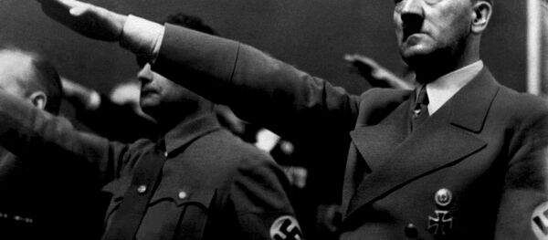 A picture dated 1939 shows German Nazi Chancellor Adolf Hitler giving the nazi salute during a rally next to Deputy Furhrer Rudolf Hess. A picture dated 1939 shows German Nazi Chancellor Adolf Hitler giving the nazi salute during a rally next to Deputy Furhrer Rudolf Hess. - اسپوتنیک افغانستان
