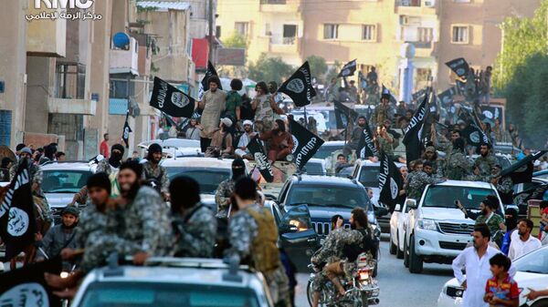 In this undated file image posted on Monday, June 30, 2014, by the Raqqa Media Center of the Islamic State group, a Syrian opposition group, which has been verified and is consistent with other AP reporting, fighters from the Islamic State group parade in Raqqa, north Syria - اسپوتنیک افغانستان  