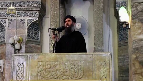 A man purported to be the reclusive leader of the militant Islamic State Abu Bakr al-Baghdadi has made what would be his first public appearance at a mosque in the centre of Iraq's second city, Mosul, according to a video recording posted on the Internet on July 5, 2014, in this file still image taken from video. - اسپوتنیک افغانستان  