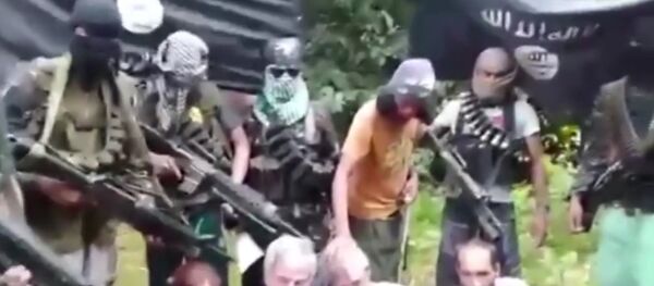 Two Canadian hostages abducted with two other people from a luxury holiday resort last month by Isis-style terrorists have claimed they are in 'grave danger' in a kidnap ransom video - اسپوتنیک افغانستان  