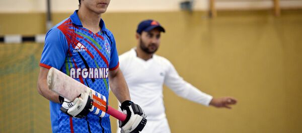 Afghan refugees take part in a Cricket training session at the team of the Altendorf 09 Blue Tigers in Essen, western Germany, on April 30, 2016. Afghan refugees take part in a Cricket training session at the team of the Altendorf 09 Blue Tigers in Essen, western Germany, on April 30, 2016. - اسپوتنیک افغانستان