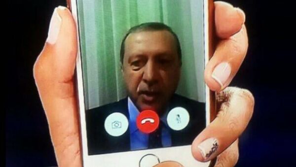 Telephone statement by Turkish President Recep Tayyip Erdogan, shown on the news on TV at an Istanbul home. - اسپوتنیک افغانستان  