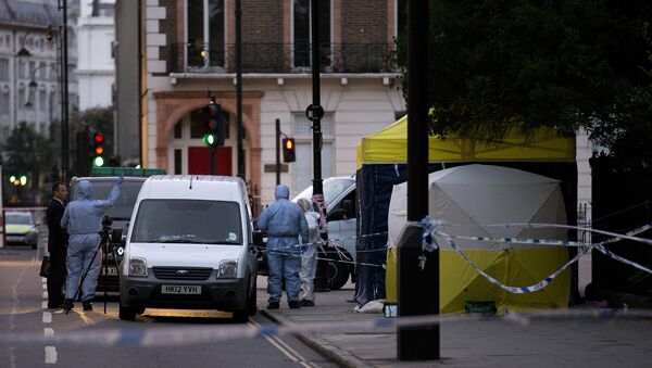 Police forensic officers work in Russell Square in London early on August 4, 2016, after a woman in her 60s was killed during a knife attack - اسپوتنیک افغانستان  