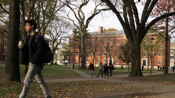 A student walks through Harvard Yard at Harvard University in Cambridge, Massachusetts, in this file photo taken November 16, 2012 - اسپوتنیک افغانستان  