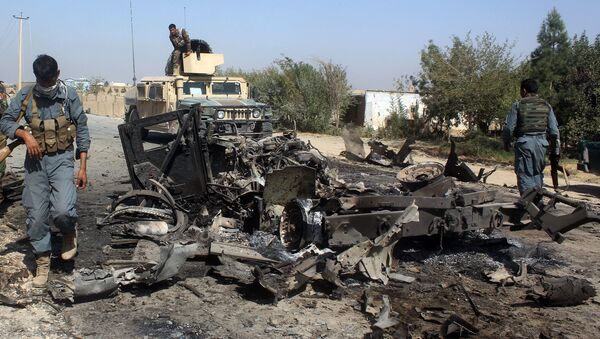 Afghan security forces inspect the site of a U.S. airstrike in Kunduz city, north of Kabul, Afghanistan (File) - اسپوتنیک افغانستان  