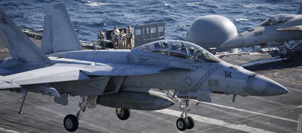 A U.S. Navy F/A-18 Super Hornet fighter lands onto the deck of the USS Ronald Reagan, a Nimitz-class nuclear-powered super carrier, during a joint naval drill between South Korea and the U.S. (File) A U.S. Navy F/A-18 Super Hornet fighter lands onto the deck of the USS Ronald Reagan, a Nimitz-class nuclear-powered super carrier, during a joint naval drill between South Korea and the U.S. (File) - اسپوتنیک افغانستان